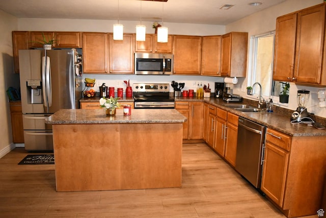 148 N Walton Ct W, North Salt Lake, UT 84054 - kitchen featuring a kitchen island, a sink, stainless steel appliances, and light wood finished floors