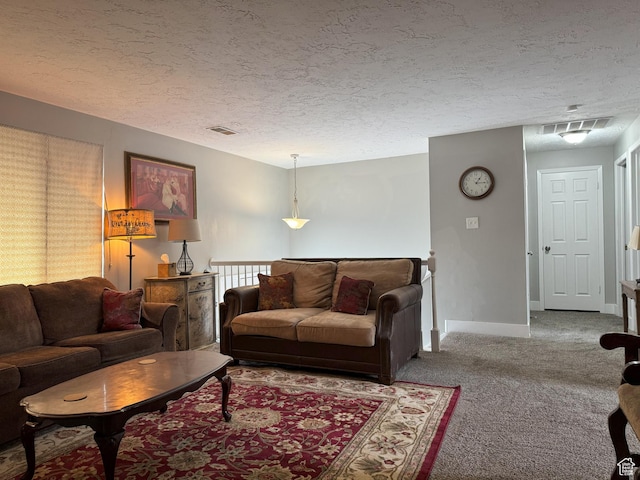 95 E Continental Dr S Unit 61-G, Farmington, UT 84025 - living area featuring baseboards, a textured ceiling, visible vents, and carpet