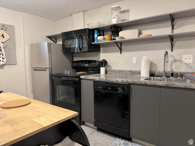 95 E Continental Dr S Unit 61-G, Farmington, UT 84025 - kitchen with a textured ceiling, a sink, open shelves, black appliances, and gray cabinets