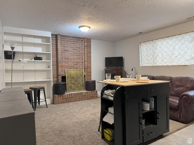 95 E Continental Dr S Unit 61-G, Farmington, UT 84025 - living room featuring light carpet, a brick fireplace, visible vents, and a textured ceiling