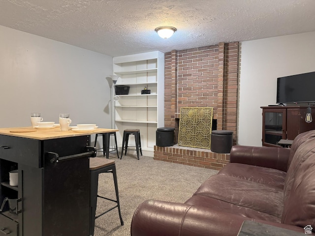 95 E Continental Dr S Unit 61-G, Farmington, UT 84025 - living area with carpet floors, a textured ceiling, and a brick fireplace