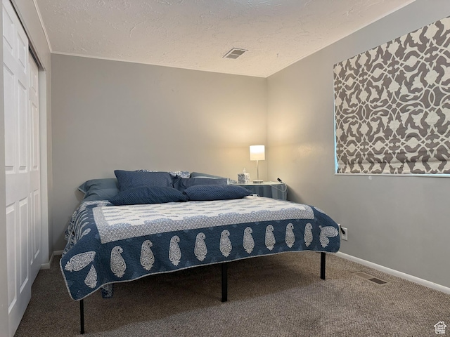 95 E Continental Dr S Unit 61-G, Farmington, UT 84025 - bedroom with baseboards, visible vents, carpet floors, and a textured ceiling