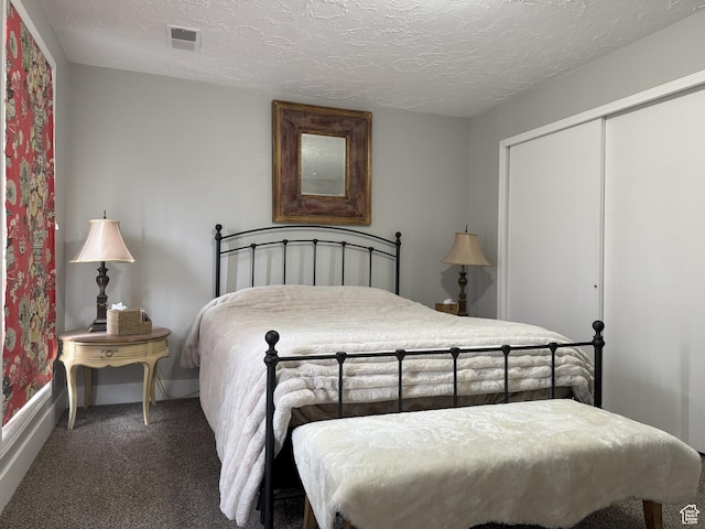 95 E Continental Dr S Unit 61-G, Farmington, UT 84025 - carpeted bedroom featuring a closet, baseboards, a textured ceiling, and visible vents
