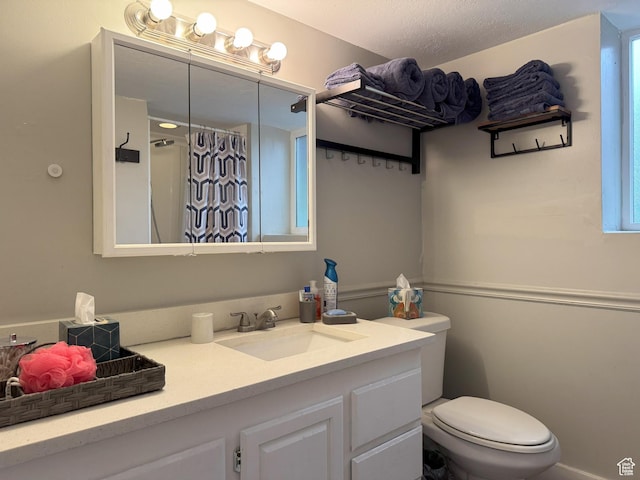 95 E Continental Dr S Unit 61-G, Farmington, UT 84025 - bathroom featuring toilet, a shower with shower curtain, and vanity