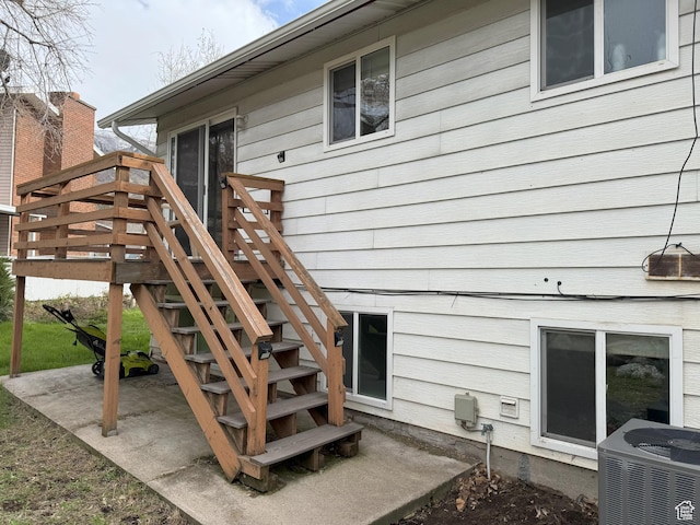 95 E Continental Dr S Unit 61-G, Farmington, UT 84025 - doorway to property with a wooden deck and central AC