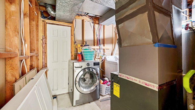 5488 S Hollow Springs Cir W, Murray, UT 84123 - clothes washing area featuring heating unit, separate washer and dryer, and laundry area