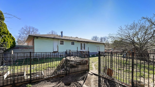 5488 S Hollow Springs Cir W, Murray, UT 84123 - rear view of house with a garden, french doors, and fence