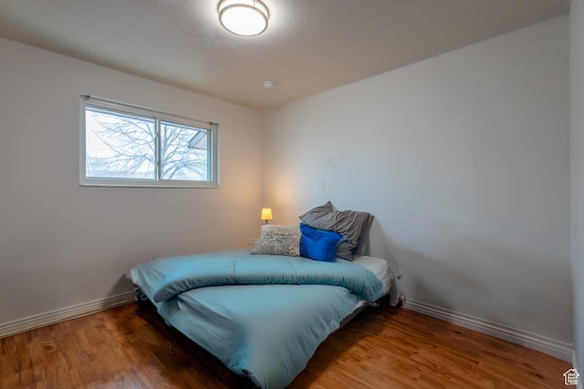 5488 S Hollow Springs Cir W, Murray, UT 84123 - bedroom with wood finished floors and baseboards
