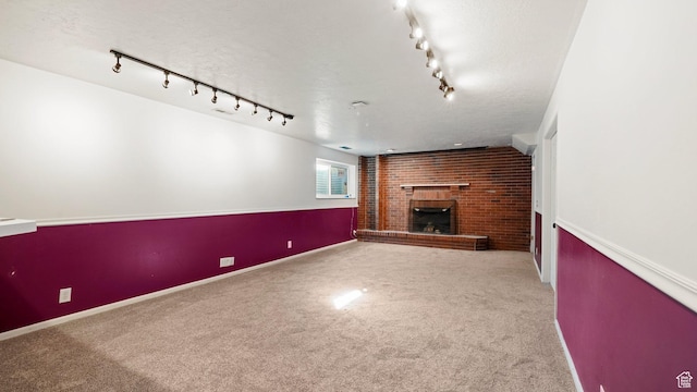 5488 S Hollow Springs Cir W, Murray, UT 84123 - unfurnished living room with carpet, a brick fireplace, a textured ceiling, and baseboards