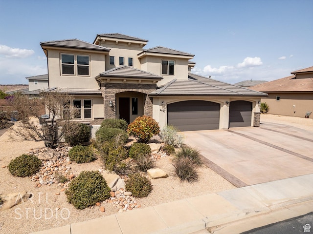 view of front facade featuring stucco siding, stone siding, and concrete driveway
