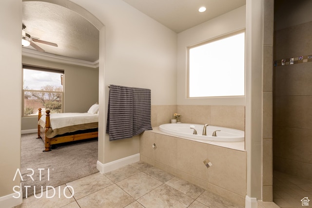 2691 E 3800 S, St George, UT 84790 - ensuite bathroom with a garden tub, a healthy amount of sunlight, tile patterned floors, and a ceiling fan
