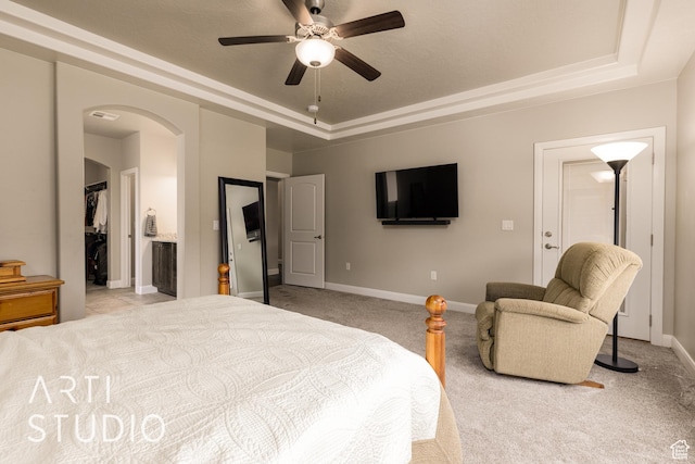 2691 E 3800 S, St George, UT 84790 - bedroom with arched walkways, a tray ceiling, baseboards, and light carpet