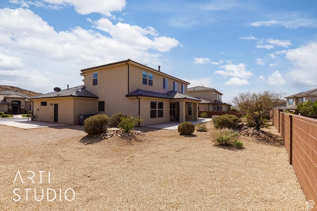 2691 E 3800 S, St George, UT 84790 - rear view of house with a tile roof, stucco siding, fence, and a patio