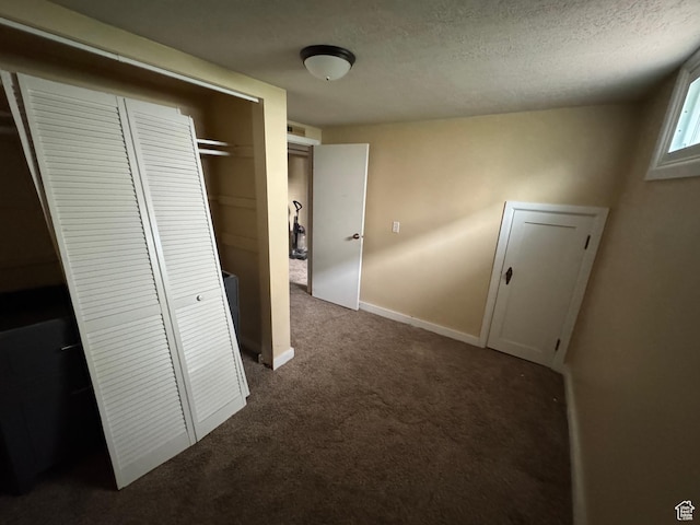 26 Sylvia Dr N, South Ogden, UT 84405 - hallway featuring baseboards, dark carpet, and a textured ceiling