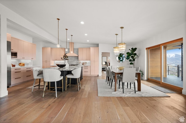 828 E Northcrest Dr, Salt Lake City, UT 84103 - dining area with recessed lighting, a notable chandelier, vaulted ceiling, and light wood-type flooring