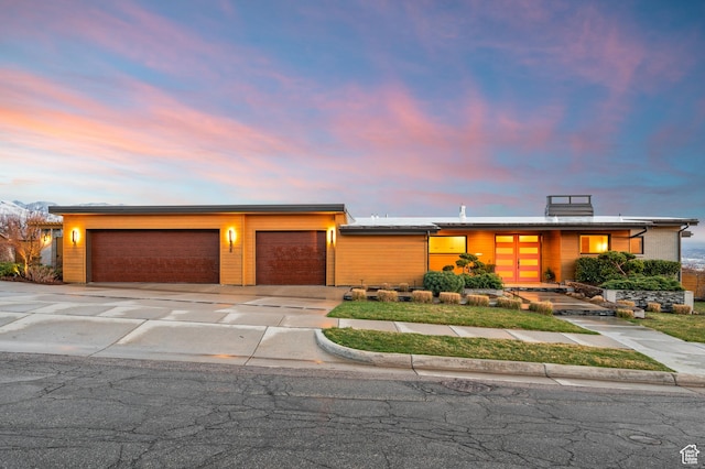 828 E Northcrest Dr, Salt Lake City, UT 84103 - mid-century modern home featuring concrete driveway and an attached garage