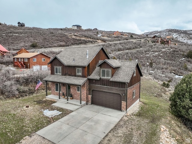 8374 E Lake Pines Dr Unit 269, Heber City, UT 84032 - rustic home featuring roof with shingles, covered porch, an attached garage, and concrete driveway
