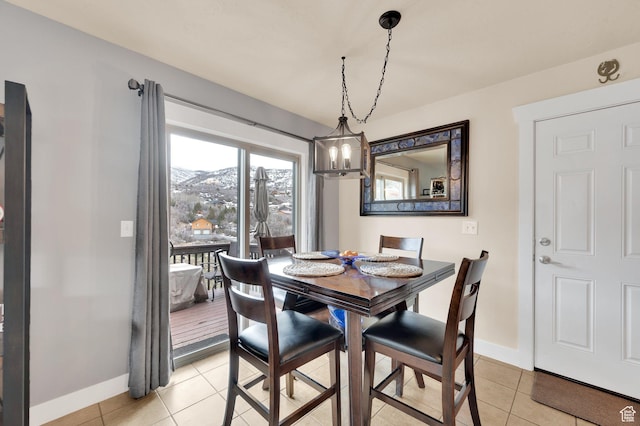 8374 E Lake Pines Dr Unit 269, Heber City, UT 84032 - dining space with baseboards, a chandelier, and light tile patterned floors