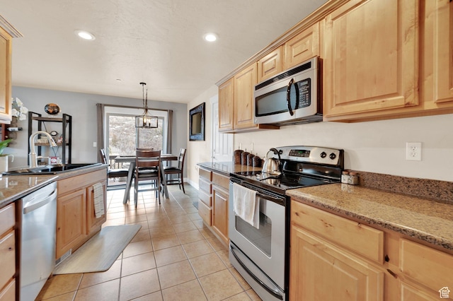 8374 E Lake Pines Dr Unit 269, Heber City, UT 84032 - kitchen featuring light brown cabinetry, recessed lighting, appliances with stainless steel finishes, a sink, and light tile patterned floors