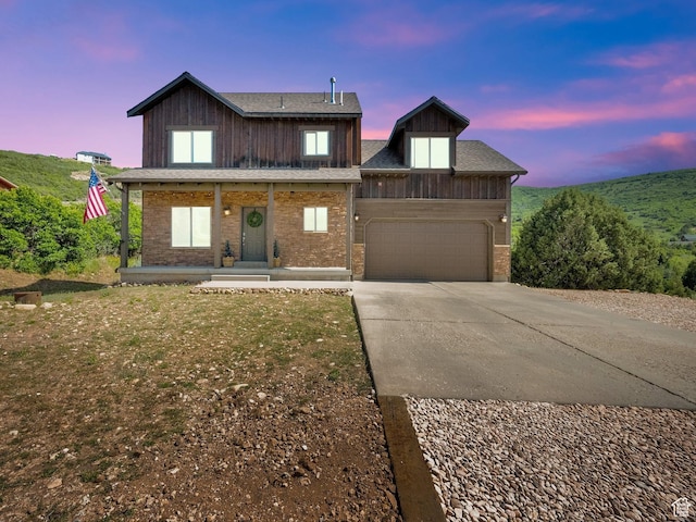 8374 E Lake Pines Dr Unit 269, Heber City, UT 84032 - view of front of house with concrete driveway, an attached garage, and covered porch