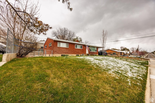 30 N 1300 E, Springville, UT 84663 - view of front of property featuring a chimney, a front yard, fence, and brick siding