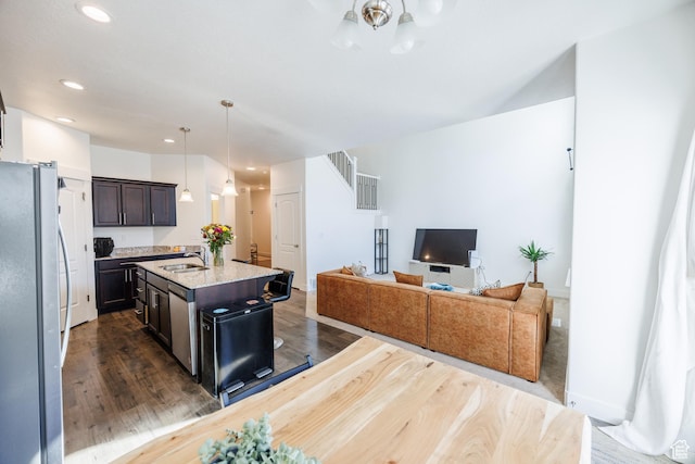 3951 W 1450 N Unit 269, Lehi, UT 84043 - kitchen with a kitchen breakfast bar, a sink, dark wood-style floors, an island with sink, and appliances with stainless steel finishes