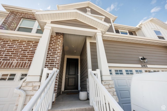 3951 W 1450 N Unit 269, Lehi, UT 84043 - view of exterior entry featuring stone siding, a garage, and brick siding