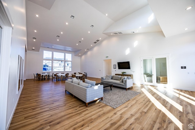 3951 W 1450 N Unit 269, Lehi, UT 84043 - living room with high vaulted ceiling, visible vents, light wood finished floors, recessed lighting, and french doors