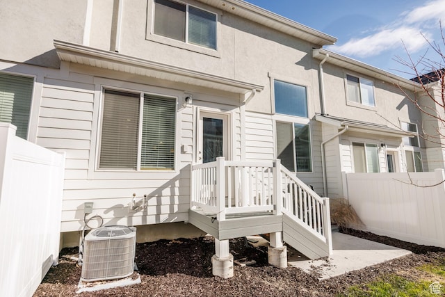 3951 W 1450 N Unit 269, Lehi, UT 84043 - entrance to property with stucco siding, fence, and central AC