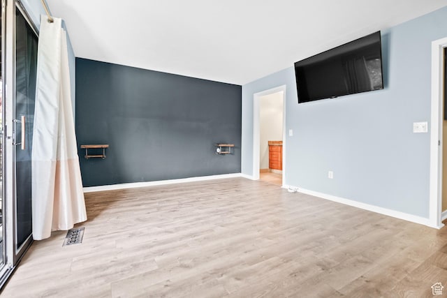 4667 S Black Swan Dr, Millcreek, UT 84117 - spare room featuring wood finished floors