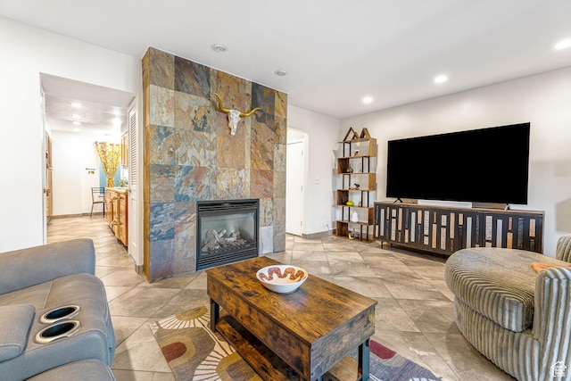 4667 S Black Swan Dr, Millcreek, UT 84117 - living area featuring a tile fireplace, baseboards, and recessed lighting