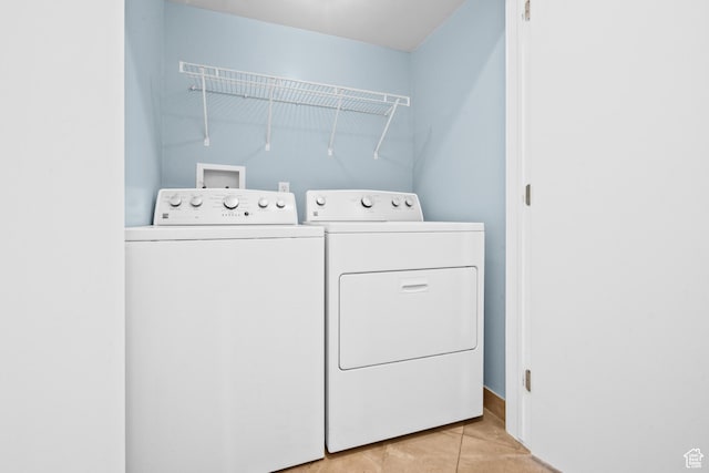 4667 S Black Swan Dr, Millcreek, UT 84117 - washroom featuring washing machine and dryer and light tile patterned floors