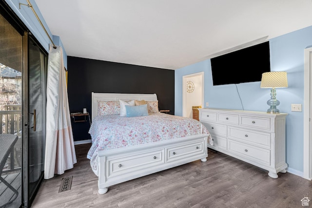 4667 S Black Swan Dr, Millcreek, UT 84117 - bedroom featuring access to exterior, visible vents, baseboards, and wood finished floors
