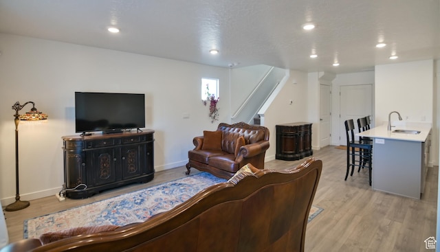 1088 E Propeller Row, Saratoga Springs, UT 84045 - living room featuring baseboards, stairs, recessed lighting, and light wood finished floors