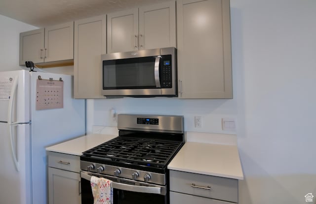 1088 E Propeller Row, Saratoga Springs, UT 84045 - kitchen with light countertops, stainless steel appliances, and gray cabinets