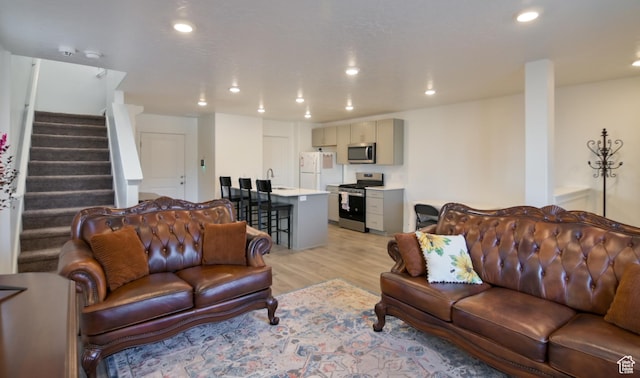 1088 E Propeller Row, Saratoga Springs, UT 84045 - living room with recessed lighting, light wood-style flooring, and stairway