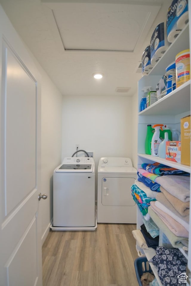 1088 E Propeller Row, Saratoga Springs, UT 84045 - laundry room with separate washer and dryer, light wood-style flooring, and laundry area