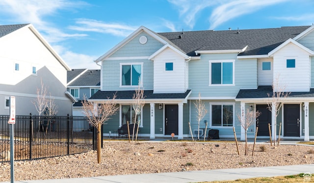 1088 E Propeller Row, Saratoga Springs, UT 84045 - back of property featuring a porch, a shingled roof, and fence