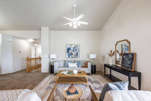 living room with baseboards, a ceiling fan, and carpet flooring