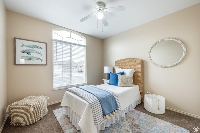 carpeted bedroom with baseboards and ceiling fan