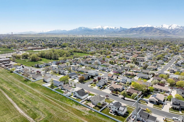 birds eye view of property featuring a mountain view and a residential view