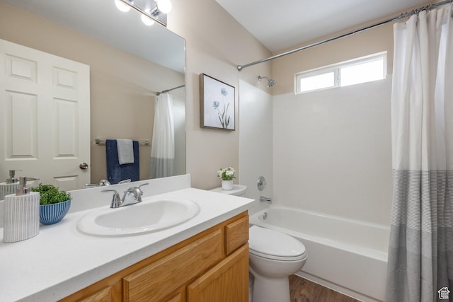bathroom featuring shower / bath combination with curtain, toilet, vanity, and wood finished floors