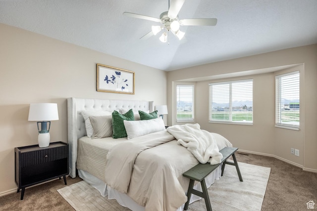 bedroom featuring lofted ceiling, carpet floors, a ceiling fan, and baseboards