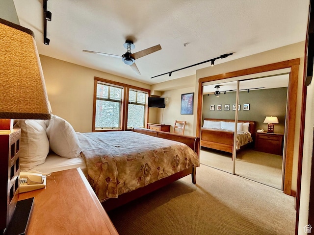 12080 E Big Cottonwood Rd Unit 214, Brighton, UT 84121 - carpeted bedroom featuring track lighting and a ceiling fan