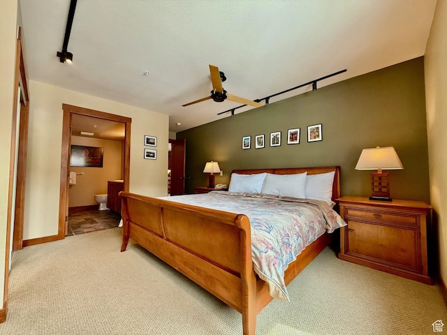 12080 E Big Cottonwood Rd Unit 214, Brighton, UT 84121 - bedroom with carpet flooring, baseboards, ensuite bath, and ceiling fan