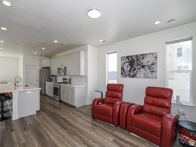 10638 S Pipestone Way W Unit 136, South Jordan, UT 84009 - living area featuring dark wood-style floors and recessed lighting