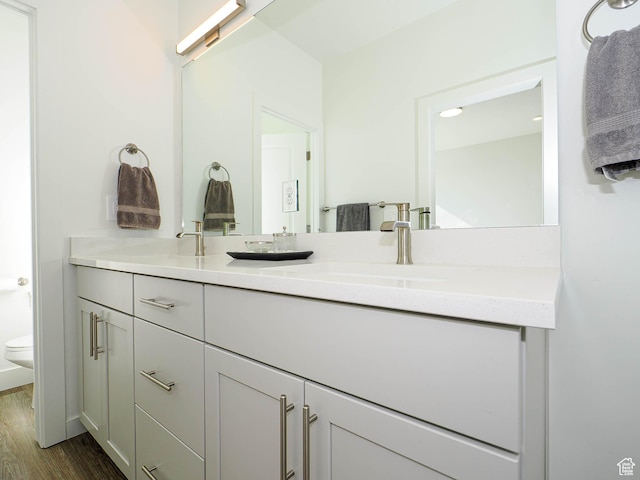 10638 S Pipestone Way W Unit 136, South Jordan, UT 84009 - full bath featuring wood finished floors, toilet, and double vanity