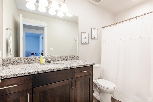 51 N 270 W, Hyrum, UT 84319 - bathroom with visible vents, toilet, and vanity