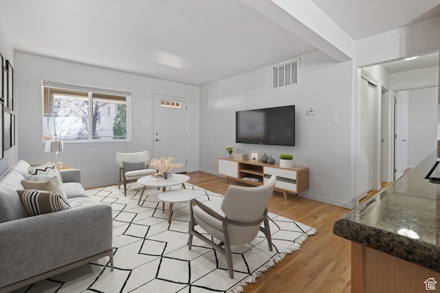 650 N 300 W Unit 231, Salt Lake City, UT 84103 - living area featuring baseboards, visible vents, and light wood-style floors