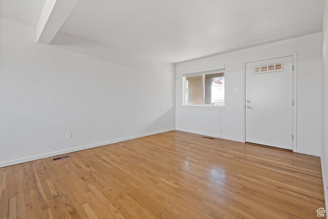 650 N 300 W Unit 231, Salt Lake City, UT 84103 - spare room featuring baseboards, visible vents, and light wood-style floors